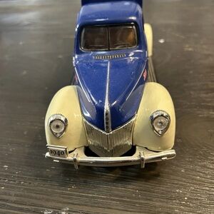 Blue and Cream Vintage Toy Car Model